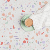 terrazzo inspired wallpaper design in pastel colors for a coffee shop