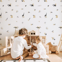 abc pattern wallpaper with animal motif for kids playroom interior