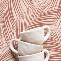 boho kitchen interior with coastal palm leaf motif wallpaper