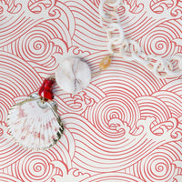 Eclectic beach house interior with pink coastal style wallpaper