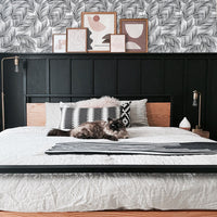 modern boho bedroom design with minimal tropical wallpaper