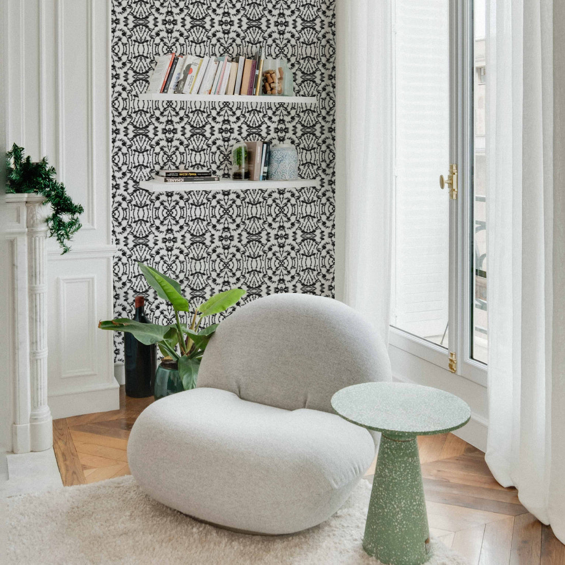 eclectic apartment corner with tribal print inspired wallpaper design in black and white