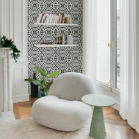 eclectic apartment corner with tribal print inspired wallpaper design in black and white