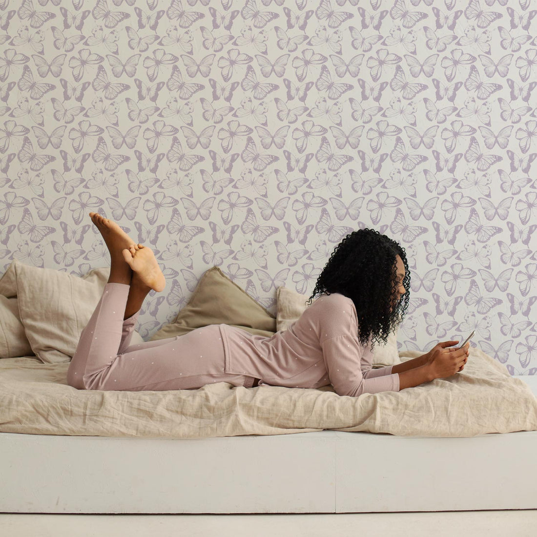 White girls teen room interior with lavender color tiny butterflies wallpaper