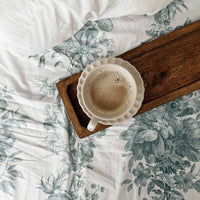farmhouse style bedroom with green bedsheet cover