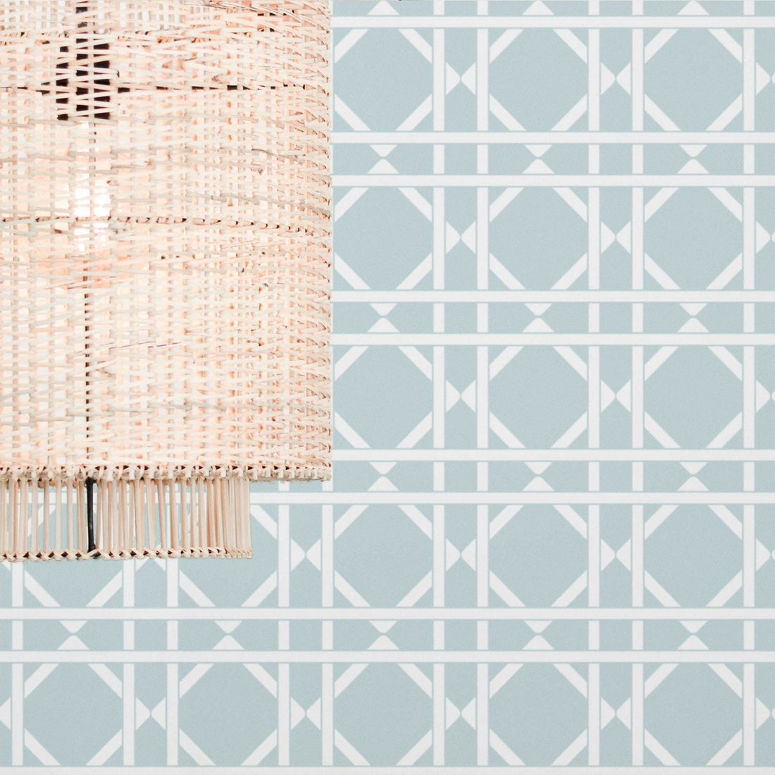 Cane pattern wallpaper in light blue color in boho interior