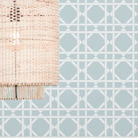 Cane pattern wallpaper in light blue color in boho interior