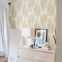 faux gold coastal inspired wallpaper with palm leaf motif