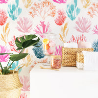 Coral wallpaper in eclectic powder room interior with indoor plants