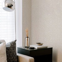 neutral living room interior with animal print wallpaper accent wall
