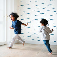 coastal style interior with blue whale print wallpaper