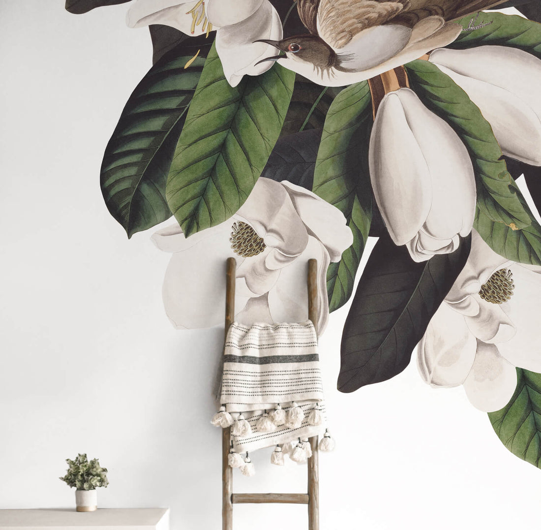 Vintage flora and fauna wall mural in neutral boho living room interior